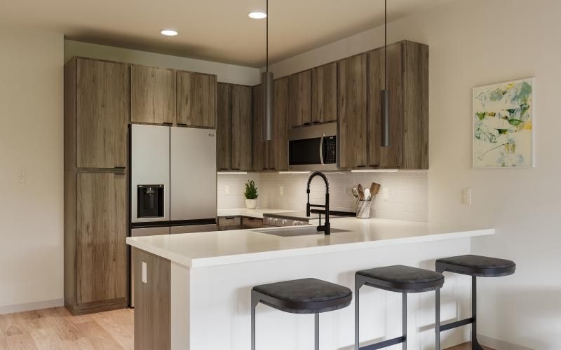 a kitchen with stools and a bar stool