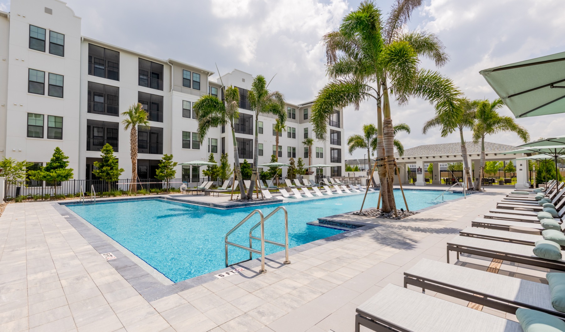 a swimming pool in front of a building